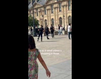Police officers roller skating in the street