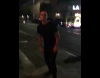 guy black shirt catches cigarette in mouth