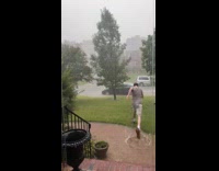 Guy runs through storm falls on ground