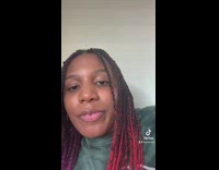 GIrl with purple and red hair talking about 23 and me kits