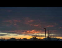 Sunset view of orange and dark clouds