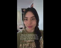 Girl looking around green shirt suspicious