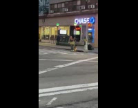 Guy and dog skateboard by chase bank 