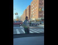 Clown man juggle pins on street crosswalk