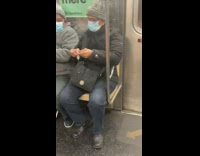 Lady cuts clips nails grey beanie subway