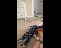 Baby climbs and then slides on back 