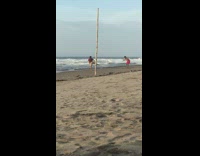 Guy multiple flip cheer dance routine beach