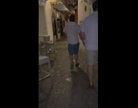 Drunk man falls on outdoor chairs 