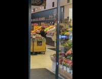 Woman grey shiny satin dress flower shop