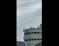Two men dances for video on ship