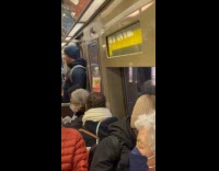 Man rides subway balance juice on head