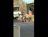 Man shirtless films and fixes pickup truck