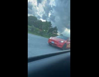 Tesla car customized Lightning McQueen on highway