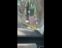 Two girls white dresses pink sign sidewalk 