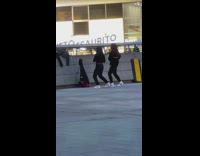 Two girls nike shoes dance beside wall