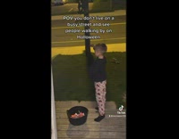 Little boy offers strangers halloween candy 