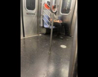 Guy bob his head to music in train