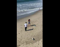 Woman in green bikini tiktok dance at the beach