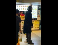 Guy in Boba Fett Costume Stands Near Restaurant 