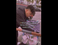 Dad loads baby into stroller