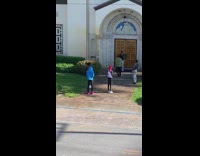 Man shoot rap music video front church