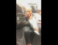 Man in tuxedo sticks roses and flowers into beard on subway train