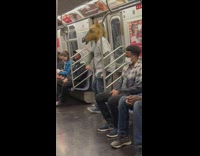 Man with horse head dances by subway train door