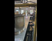 Lady uses camera to take pictures of food