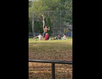 Girl does handstand on guys hand park