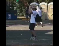 music guy holding inflatable palm tree dancing 