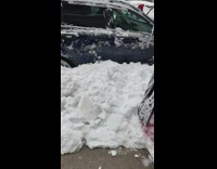 Colorful snowman on sidewalk with scary mask 