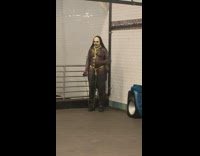 Shirtless guy in horror chain outfit does arm workouts 