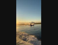 Man rides jet ski through wave fell