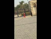 Man in red outfit bicycle kick gate entrance