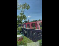 Shirtless man stand on colored square arch