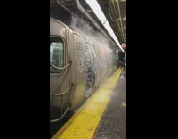 Rain floods cover subway train entrance