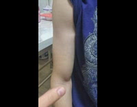 Guy blue top flex his arm muscles