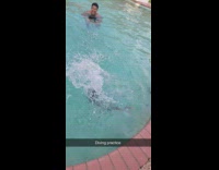 Little girl funny dive into pool