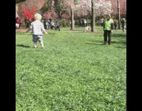 Blonde Baby Falls While Running Down Hill