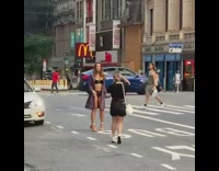 Woman violet coat black bikini underneath street pictorial