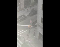 Collab WINY - Man shirtless exercises at sidewalk traffic light