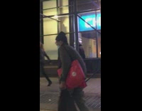 Guy wears clear bubble helmet while walking