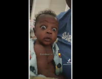 Baby boy keeps eyes open wide