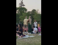 Woman green dress look at Eiffel tower