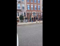 Group film on street with cardboard door