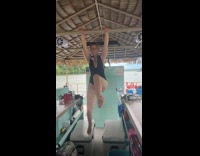 Woman in bikini hangs slips in boat