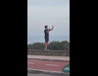 Guy black shirt open and close hand