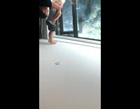 Man Holds Kid Upside Down on Hips