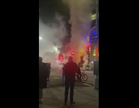 Large amounts of white smoke emerge from street floor