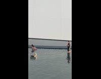 Woman white bikini split struggle poolside photographer